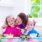 Mother and children having breakfast