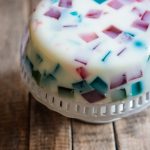 White jelly cake with colorful cubes